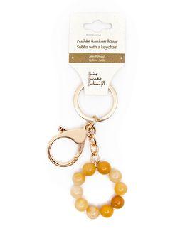 من معدن الإنسان سلسة مفاتيح (سبحة) - يشم أصفر